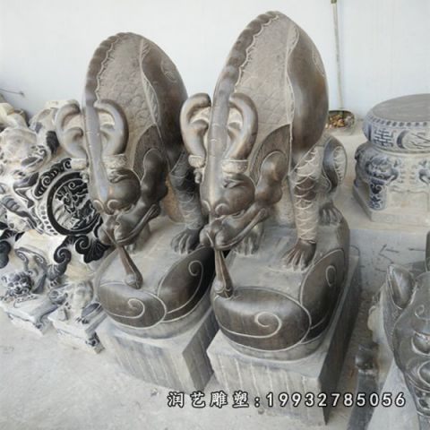 城市吸水兽石雕